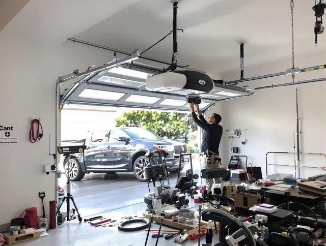 Norwich Garage Door Repair specialist installing smart garage door opener system in Norwich home