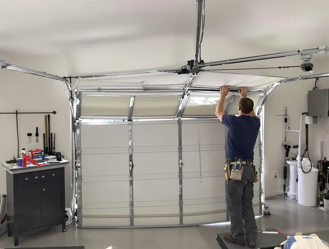 Norwich Garage Door Repair specialist performing precise section replacement on Norwich garage door