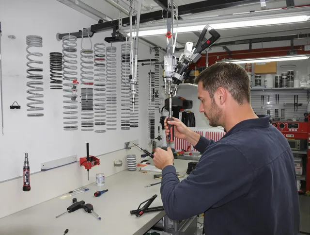 Norwich Garage Door Repair safety certified technician performing precision spring replacement in Norwich